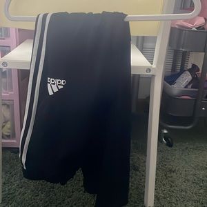 Black Adidas joggers with zipper pockets